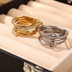 Exquisite multi-layer stackable stainless steel rhinestone rings, delicate fashion detail.