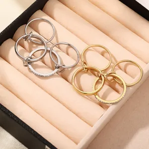 Stainless steel multi-layer interlocking stackable ring detail shot, elegant jewelry display.