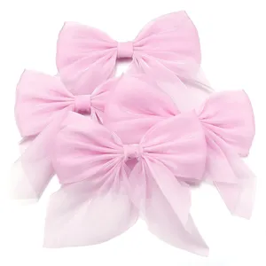 Close-up of pink chiffon bows, perfect for hair accessories, clothing, and craft decor.