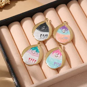 Stainless steel teardrop DIY jewelry pendant detail with colorful enamel and pearl accents.