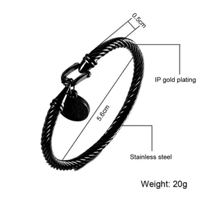 Bracciale rigido in acciaio inossidabile nero con grillo a U e ciondolo medaglia, gioiello.