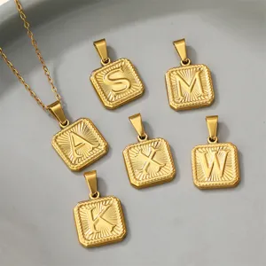 Gold stainless steel alphabet letter pendant necklace set, detailed view of square initial charms.