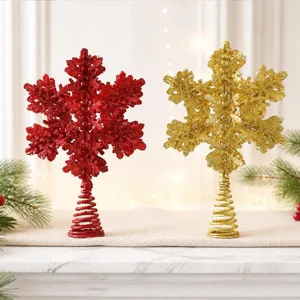 Sparkling glitter snowflake tree topper detail in red and gold, perfect for festive holiday decorations.