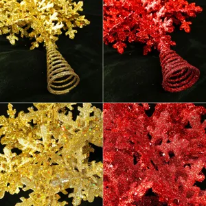 Detailed view of glitter snowflake Christmas tree topper in gold and red with spiral base.