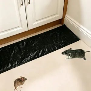Black sticky mouse trap mat for home pest control, strong glue catcher for rodents.