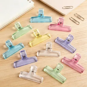 Colorful translucent wide plastic binder clips for office data, journal storage and home stationery.