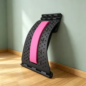 Detail view of back stretcher lumbar support with massage points and ergonomic curved design.