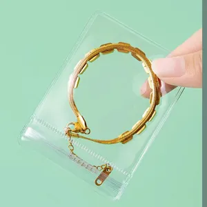 Pochette de rangement transparente en PVC avec bracelet chaîne serpent dorée élégant