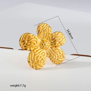 Detail shot of the textured gold-plated stainless steel floral ring showcasing its unique design.