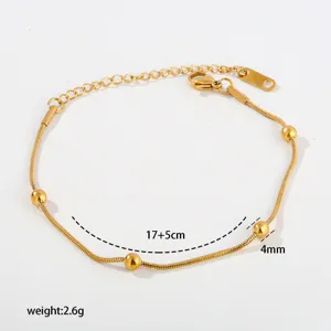 Stainless steel snake chain bracelet with beads, elegant minimalist design, adjustable length.