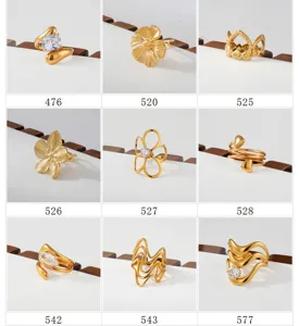Gold stainless steel rings set, versatile stacking designs with cubic zirconia details.