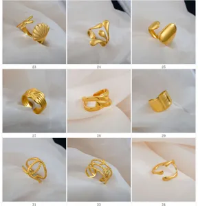 Adjustable stainless steel rings set featuring retro geometric and ocean designs in gold finish.
