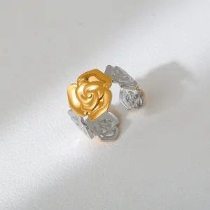 Close-up detail of the trendy two-tone stainless steel rose ring, showcasing exquisite finish.