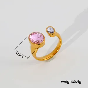Minimalist stainless steel open ring with pink and purple zirconia stones, stylish design.