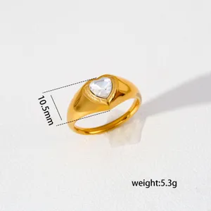 Stainless steel chunky heart ring detail, gold plated thick band with clear cubic zirconia.