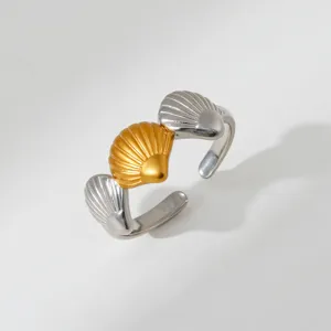 Two-tone stainless steel open ring featuring decorative shell motifs for modern stylish look detail