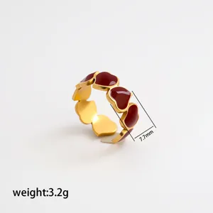 Close-up detail shot of the stainless steel gold-plated red enamel heart ring showing size 7.7mm