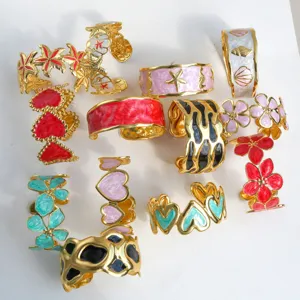 Stylish open cuff bracelet set featuring colorful enamel hearts and floral designs for women.