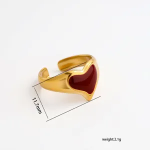 Exquisite stainless steel heart adjustable ring featuring wine red enamel and gold finish detail.