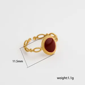 Stainless steel open ring detail view, featuring a chic wine red enamel oval stone design.