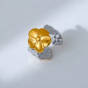 Detailed view of the two-tone stainless steel flower open ring, showing metallic texture.