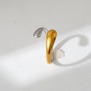 Two-tone stainless steel open ring detail view, modern fluid minimalist jewelry design.