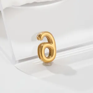 Detailed view of the elegant stainless steel gold-plated letter charm for DIY jewelry design.