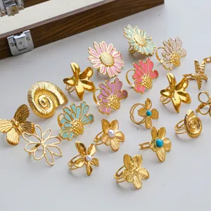Gold stainless steel floral and marine ring collection, detailed view of various charming rings.