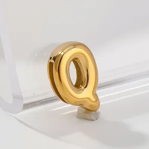 Gold letter Q pendant detail shot, stainless steel alphabet charm close-up display.