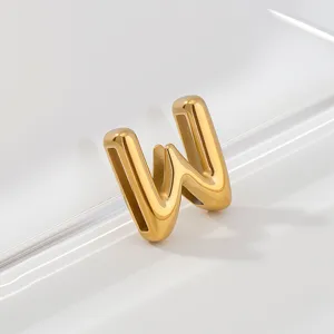 Closeup of a stylish gold-plated letter W pendant charm, showing glossy metallic texture.