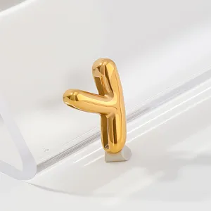 Detailed close-up shot of the polished gold letter pendant, exquisite metallic shine and finish.