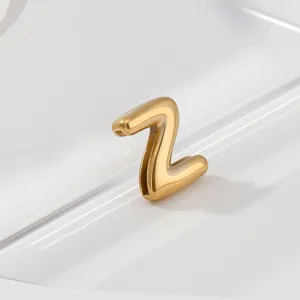 Gold stainless steel letter Z charm close up detail showing smooth polished metal finish.