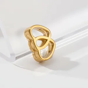 Gold stainless steel geometric pendant charm detail view, high polished shine jewelry piece.