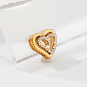 Close-up detail of the gold-tone stainless steel rhinestone heart pendant accessory.