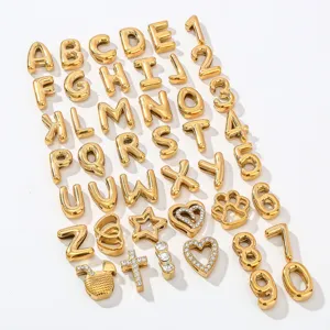 Gold letter and number charms detail view, stainless steel DIY pendant for bracelet jewelry.