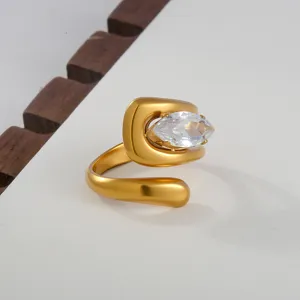 Detail shot of a stylish 18k gold-plated open ring featuring a sparkling marquise cut zircon.
