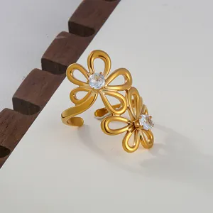 Exquisite stainless steel cubic zirconia open ring featuring elegant double flower design in gold.