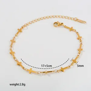 Stainless steel cross charm bracelet with extension chain, minimalist gold fashion jewelry.