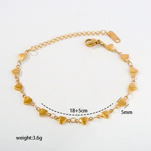 Gold stainless steel heart charm bracelet with extension chain, elegant minimalist jewelry.