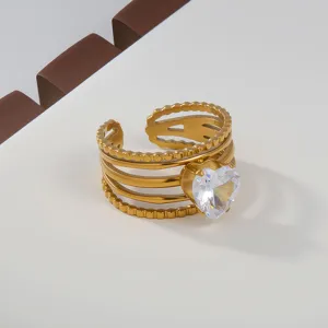 Stainless steel multi-layer open ring detail, featuring a sparkling heart crystal accent.