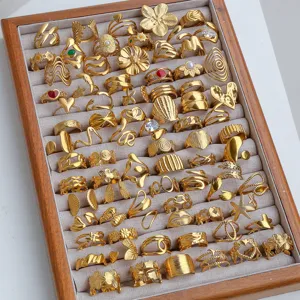Wholesale bulk stainless steel adjustable gold rings set, assorted fashion jewelry display.