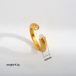 Minimalist gold stainless steel open ring with sparkling zircon and white bead detail.