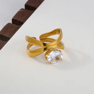 Close-up of stainless steel cross open ring with clear cubic zirconia crystal detail.