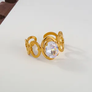 Detailed close-up of gold stainless steel open ring with sparkling oval cubic zirconia.