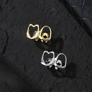 Gold and silver hip hop grillz tooth cap set with hollow heart and star design for party.