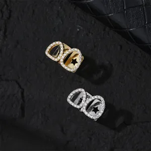 Detail shot of hip-hop hollow grillz with sparkling cubic zirconia in gold and silver colors.