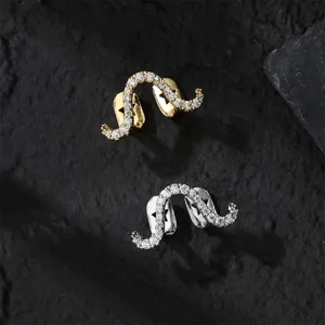 Close-up detail view of iced out hip-hop grillz paved with sparkling cubic zirconia.