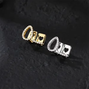 Hollow design grillz with cubic zirconia, stylish copper hip hop teeth jewelry for party.