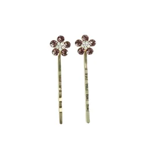 Gold bobby pins featuring purple crystal flower rhinestones, elegant hair accessories for women.