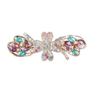Elegant rhinestone hair clip featuring a sparkling clover and bow design, perfect for women's daily hairstyles.